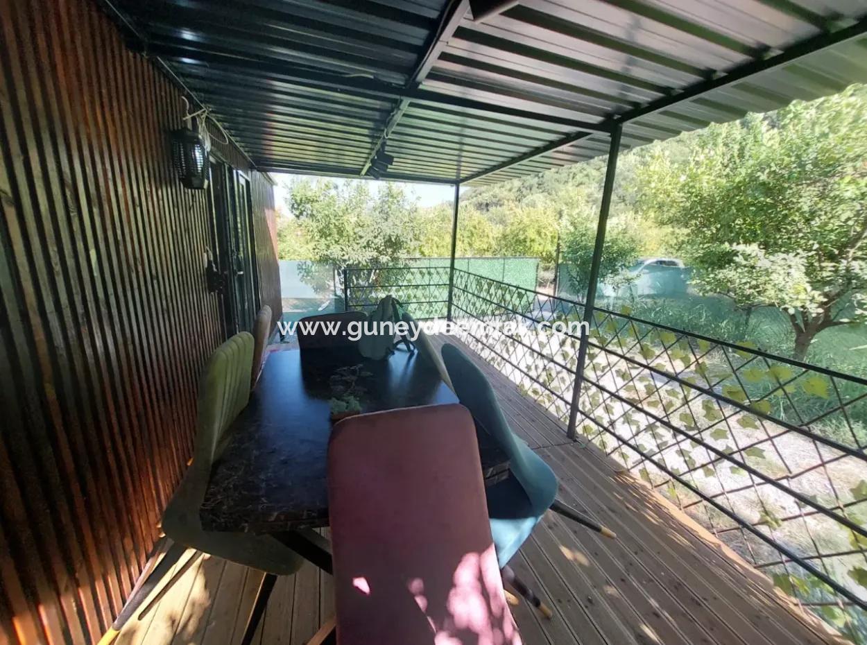 Ortaca Okçular’da 21 M² Eşyalı 1+1 Konteyner Ev – Yıllık Kiralık